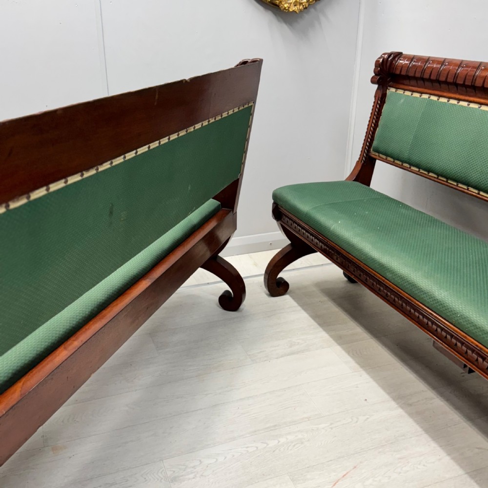A pair of 19th-century carved mahogany benches featuring green upholstered seats and backrests supported by scrolled legs. View VII