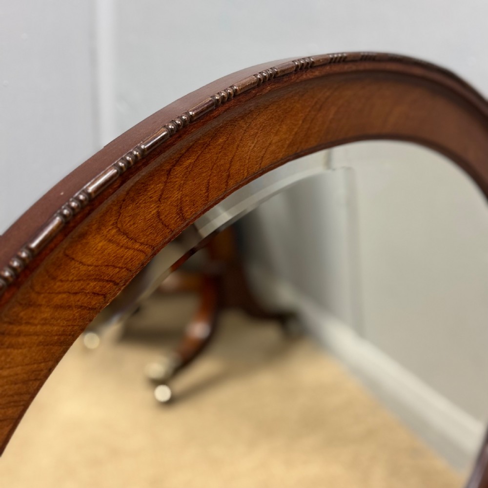 Oval mahogany framed mirror with bevelled glass View V