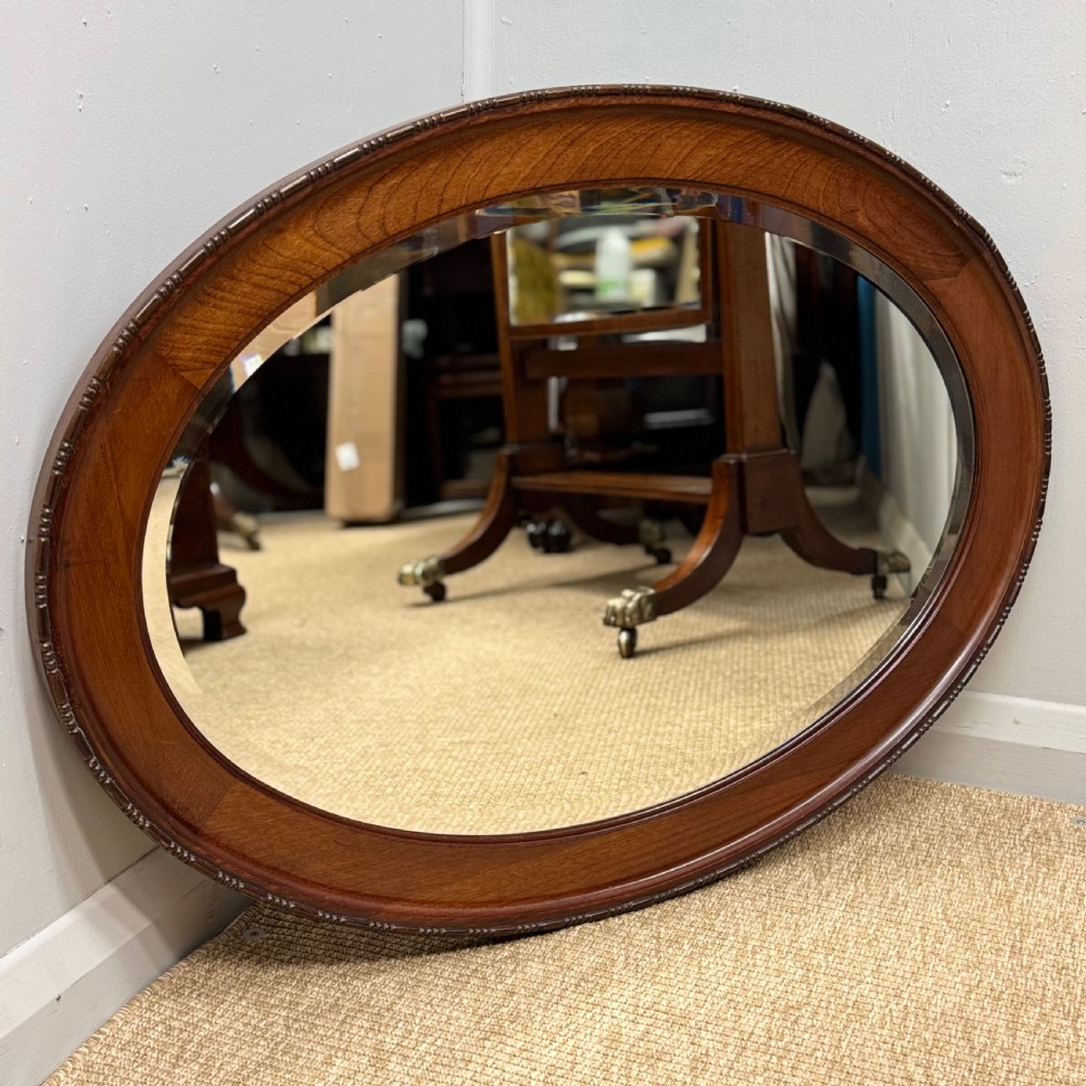 Oval mahogany framed mirror with bevelled glass View VI