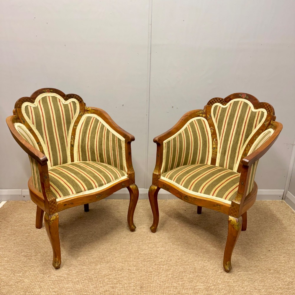 A pair of satinwood armchairs featuring hand-painted Chinoiserie detail, cabriole legs, and striped green, beige, and red fabric upholstery. View III