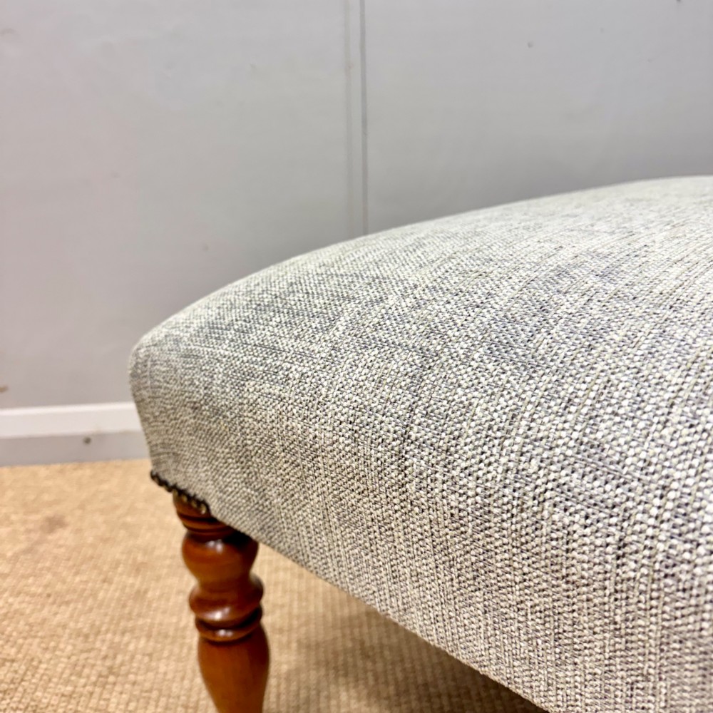 Newly upholstered large footstool View IV