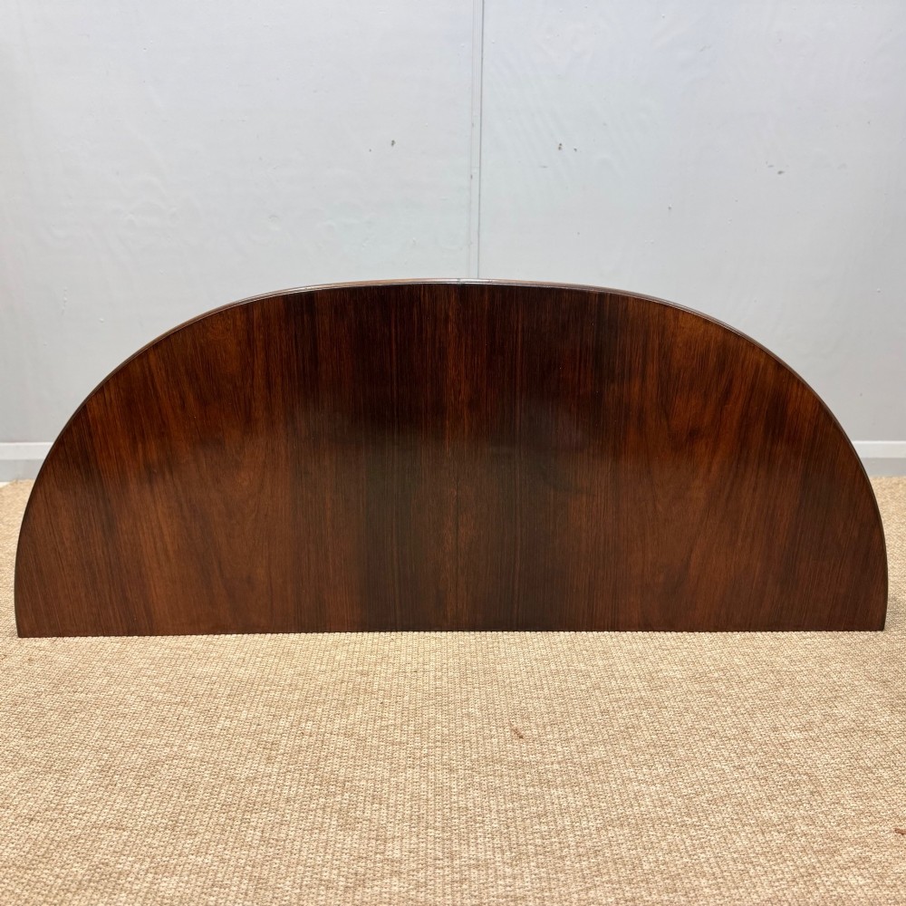 A 19th-century rosewood demilune console table featuring a semi-circular top, plain apron, and four sweeping concave legs. View III