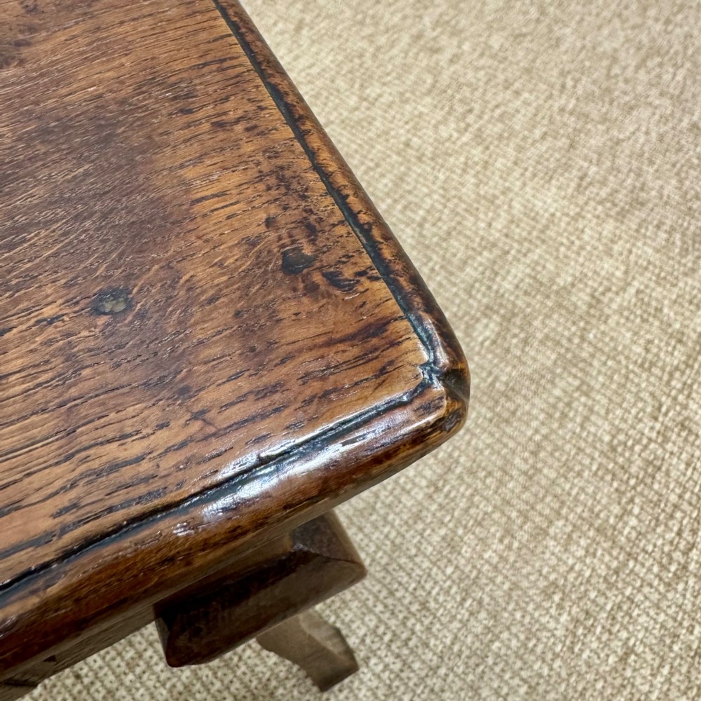An 18th-century oak low side table featuring cabriole legs, three drawers with brass drop handles, and a shaped apron. View IV