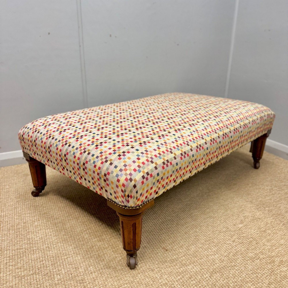 Large geometric footstool on castors