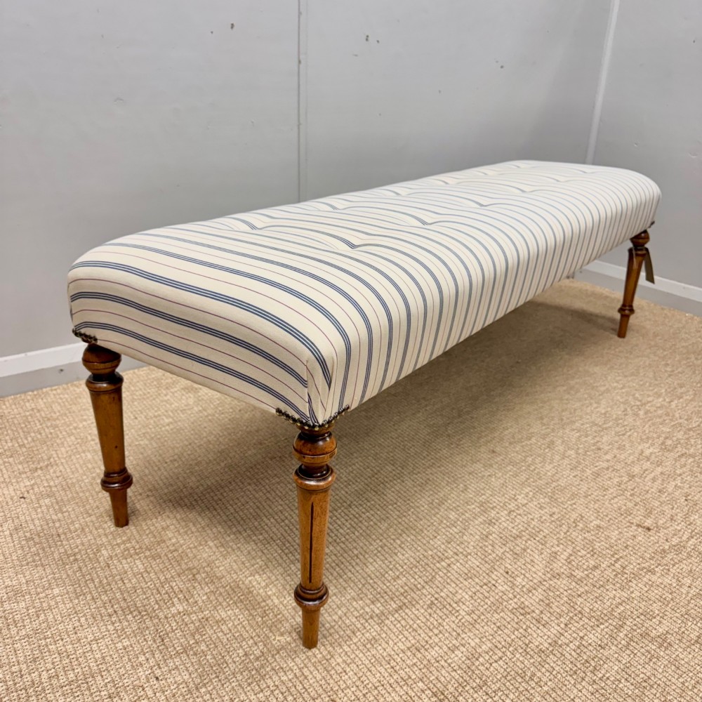 5 ft buttoned stool on walnut legs