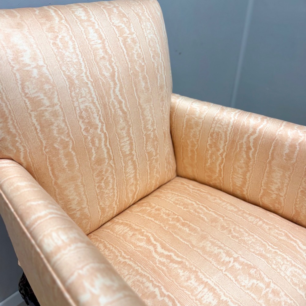 A Georgian armchair upholstered in pale peach damask fabric featuring carved mahogany hipped cabriole legs with claw and ball feet. View VII