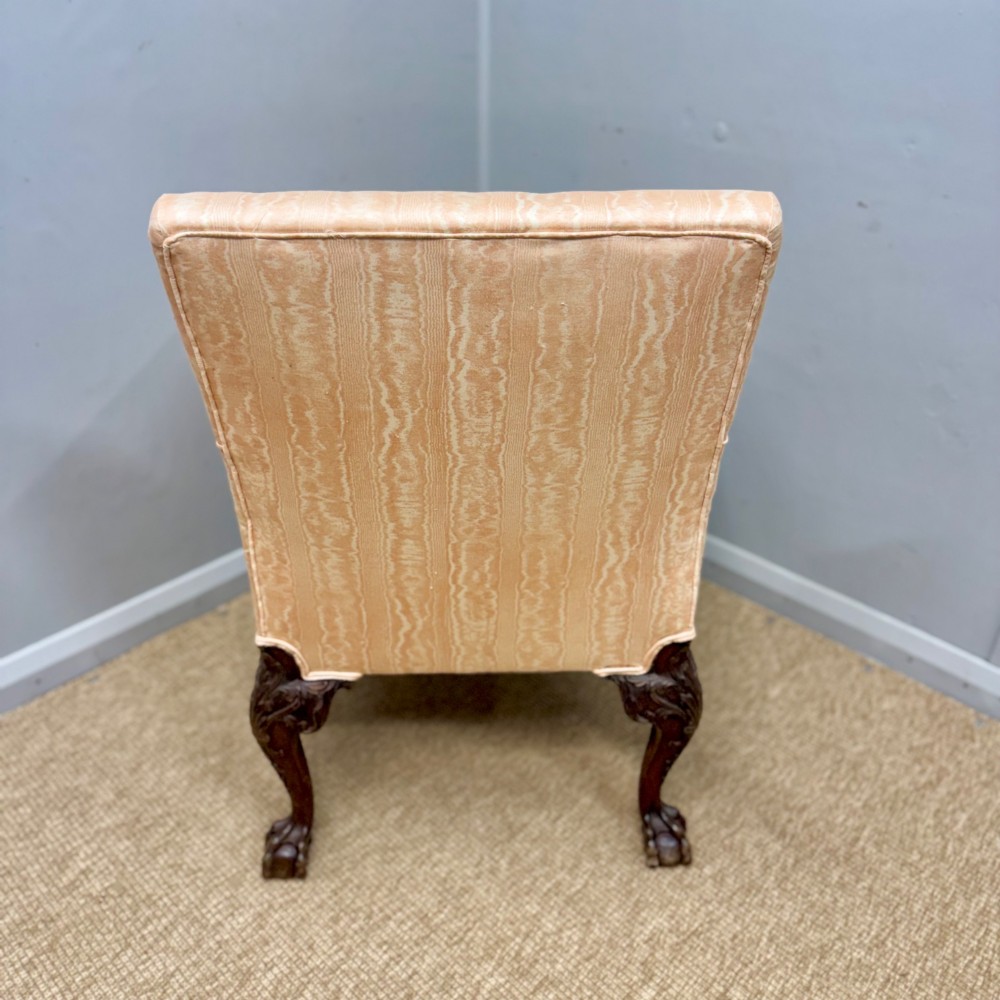 A Georgian armchair upholstered in pale peach damask fabric featuring carved mahogany hipped cabriole legs with claw and ball feet. View VIII