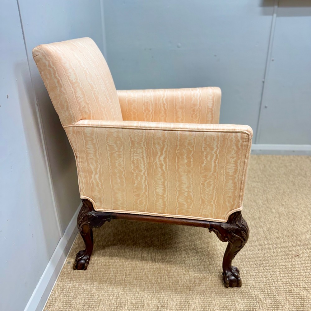 A Georgian armchair upholstered in pale peach damask fabric featuring carved mahogany hipped cabriole legs with claw and ball feet. View IX