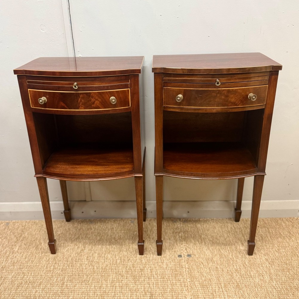 Pair of bow front inlaid bedside tables