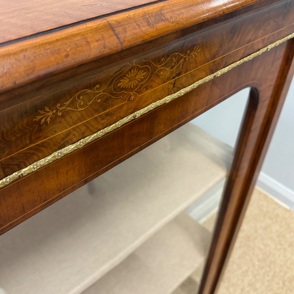Victorian walnut pier cabinet featuring a single glazed door, floral marquetry inlay on the frieze, brass rim trim, and a three-tier fabric-lined interior. View II