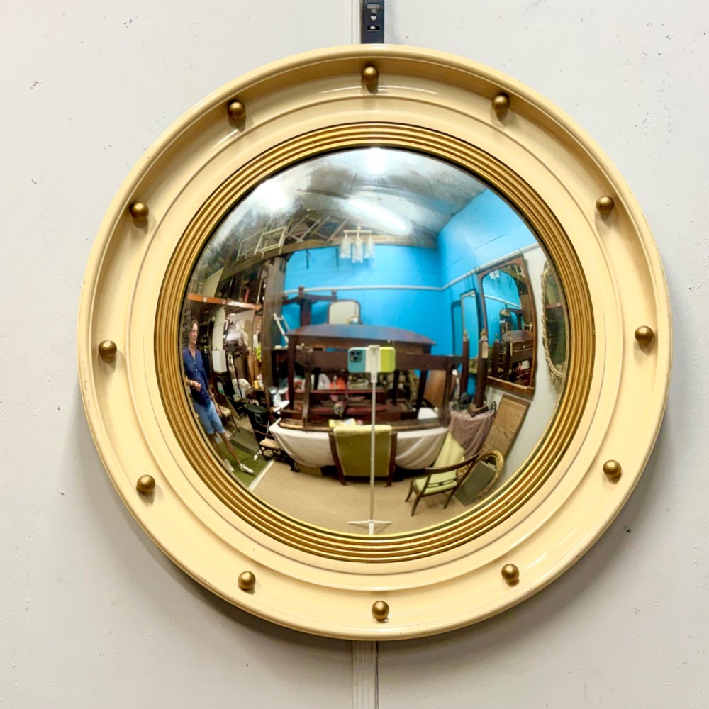 Paint and gilt round butlers mirror with convex glass