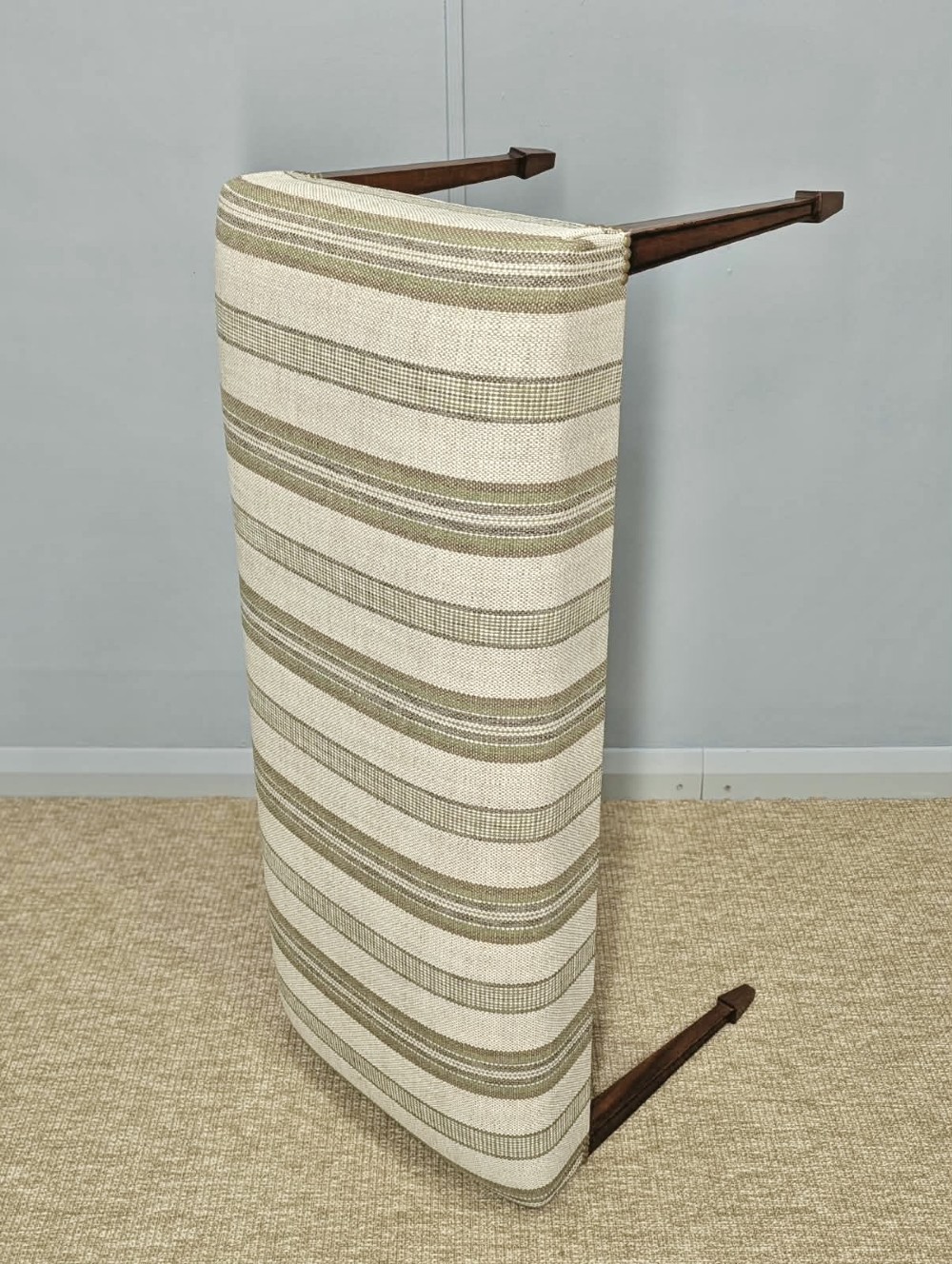 An Edwardian rectangular satinwood piano stool upholstered in beige striped fabric with square tapered legs. View IV