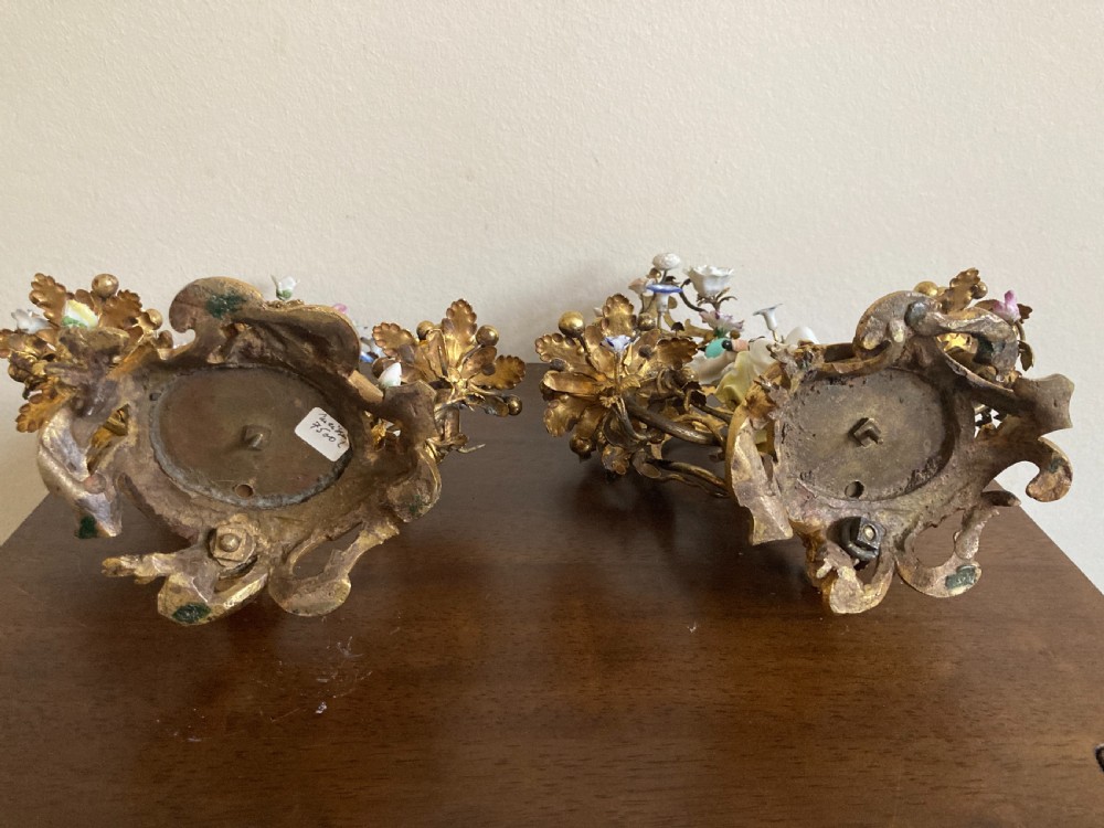 A pair of 18th-century Rococo gilt bronze candelabra featuring seated Meissen porcelain musician figures against floral trellis backdrops. View XIII