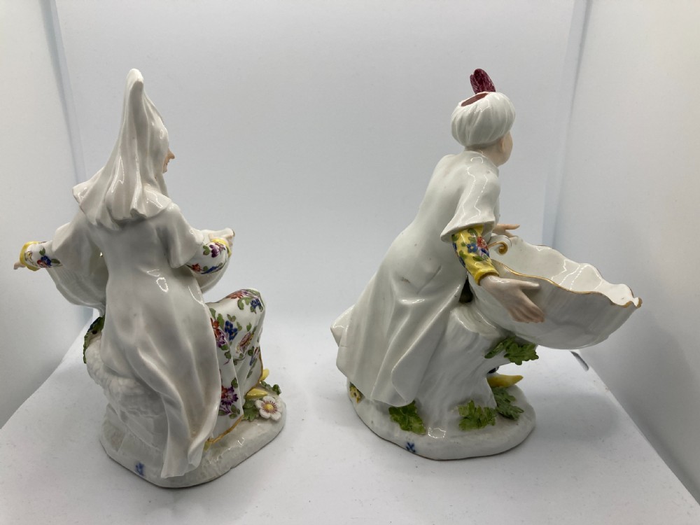 A pair of 18th-century Meissen hard-paste porcelain figures wearing Ottoman garments, each holding a scallop shell-shaped dish. View VII