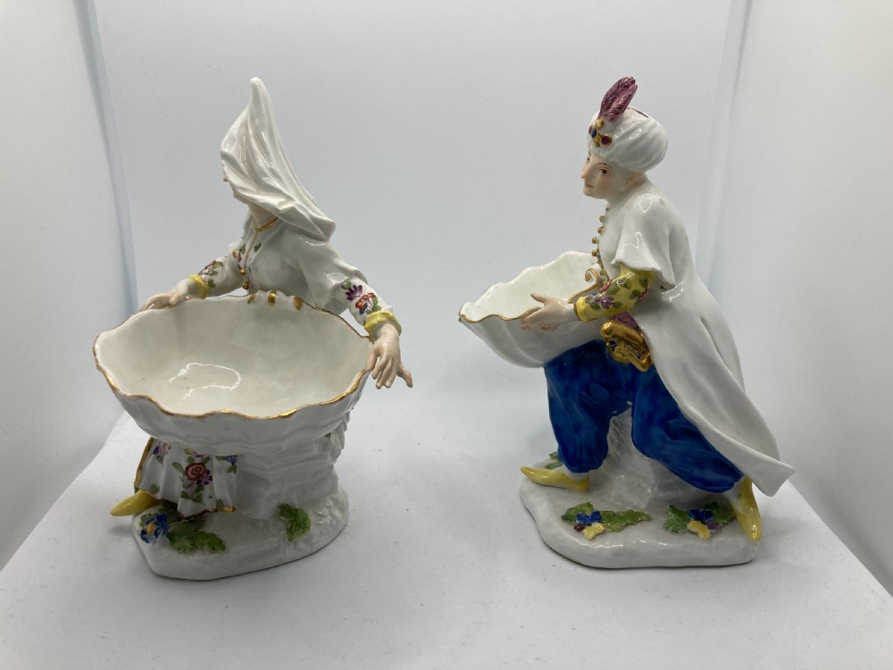 A pair of 18th-century Meissen hard-paste porcelain figures wearing Ottoman garments, each holding a scallop shell-shaped dish. View XI