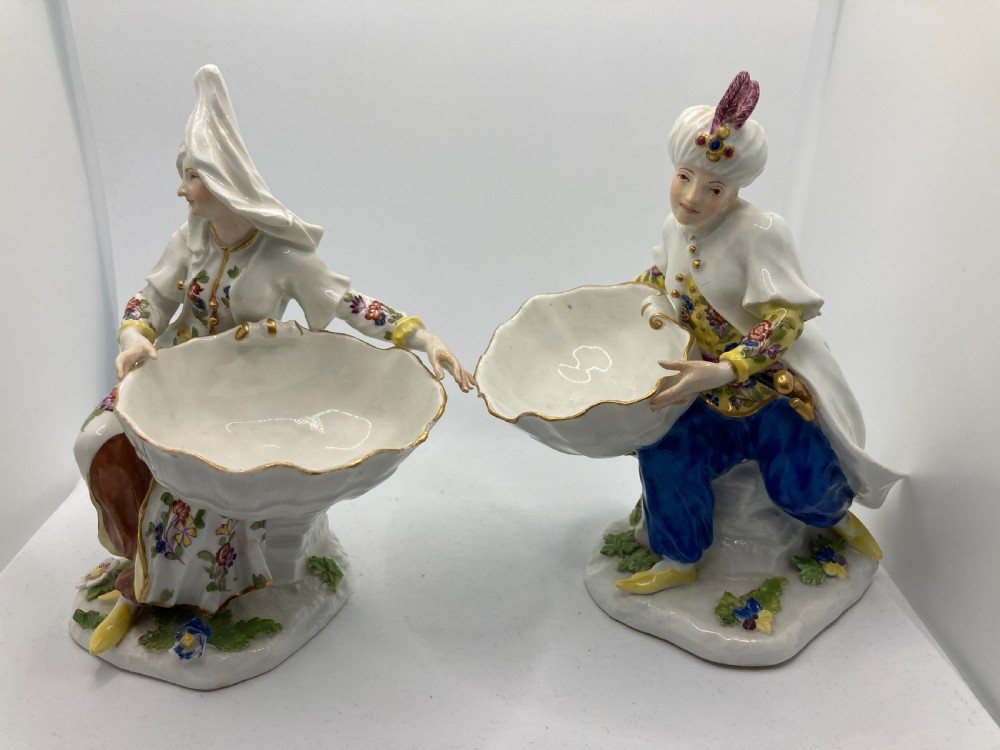 A pair of 18th-century Meissen hard-paste porcelain figures wearing Ottoman garments, each holding a scallop shell-shaped dish. View XII