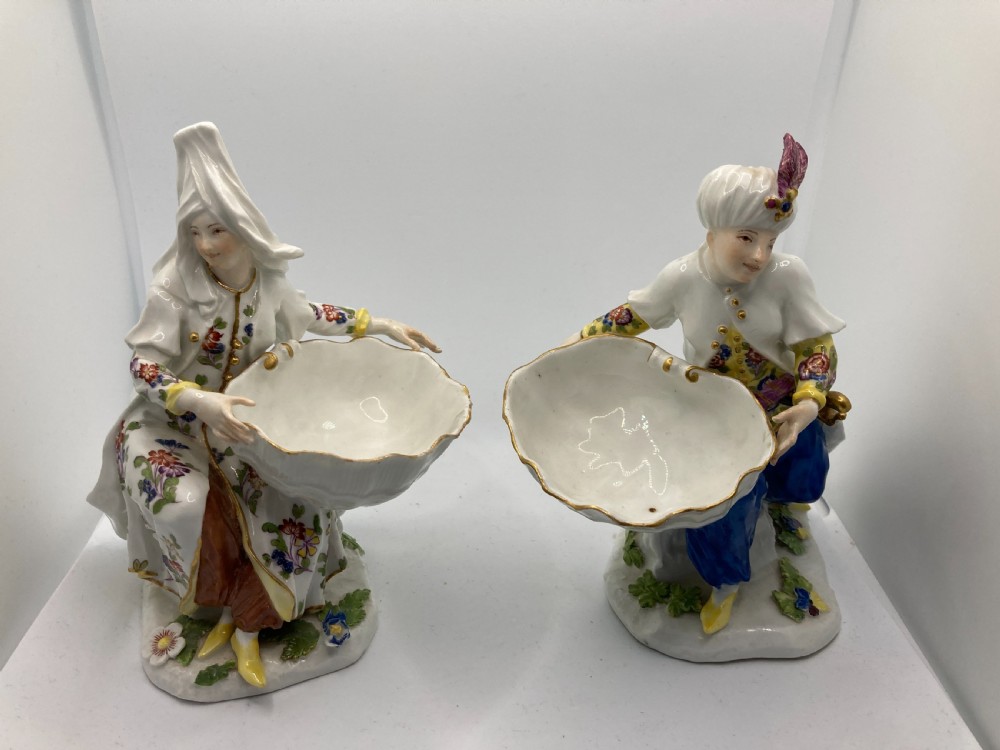 A pair of 18th-century Meissen hard-paste porcelain figures wearing Ottoman garments, each holding a scallop shell-shaped dish. View XIII