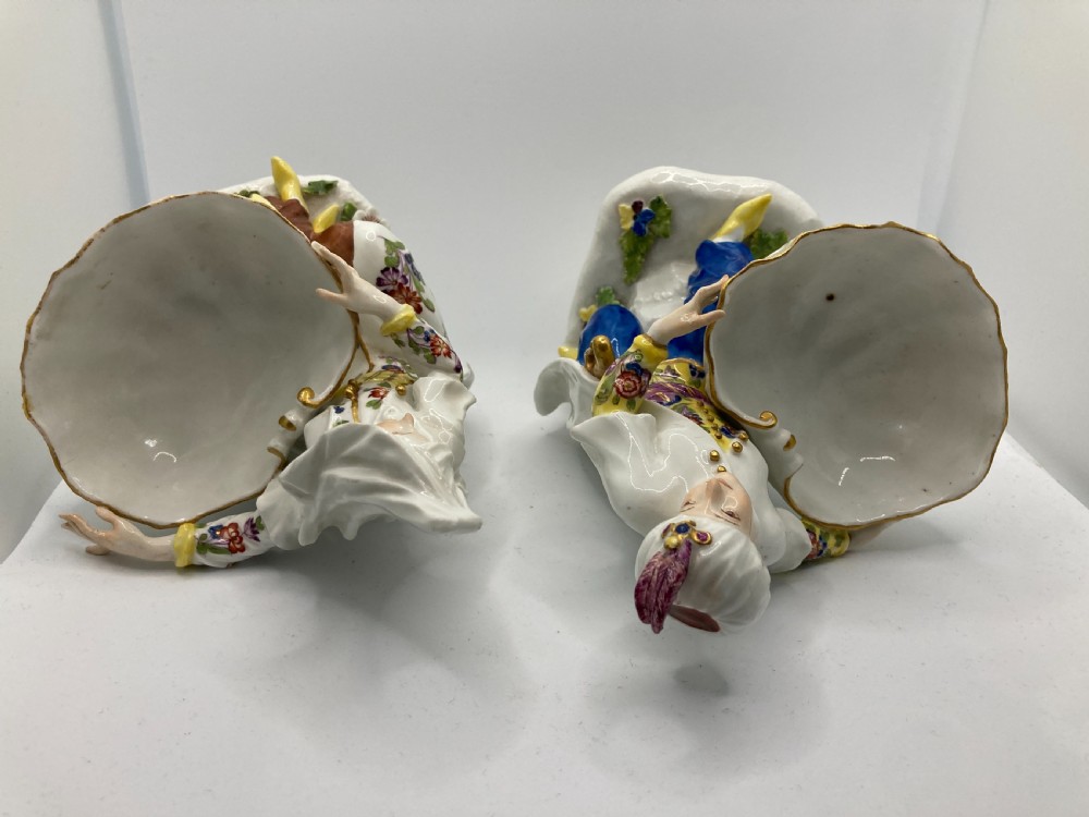 A pair of 18th-century Meissen hard-paste porcelain figures wearing Ottoman garments, each holding a scallop shell-shaped dish. View XV