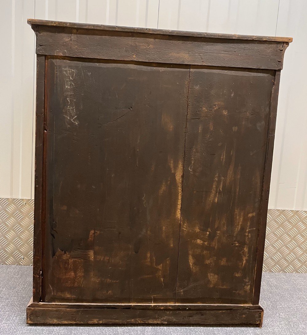 A Regency rosewood side cabinet featuring a brass lattice door with pleated fabric backing, ornate brass mounts, and brass marquetry inlays. View IX