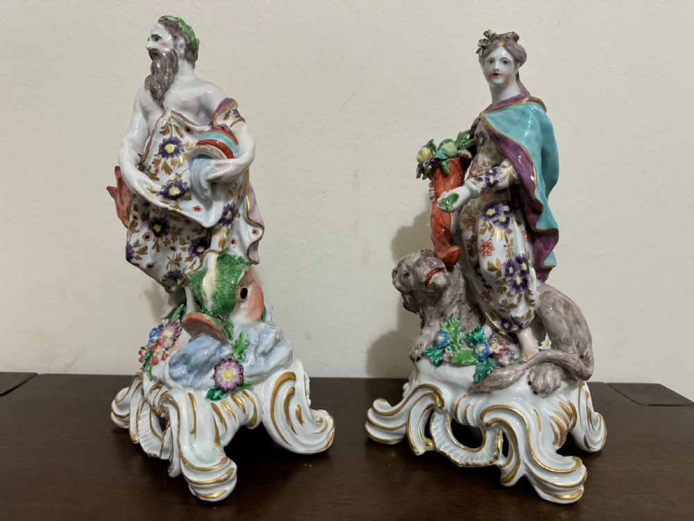 A pair of 18th-century polychrome porcelain allegorical figures depicting Water and Land resting on gilded Rococo scroll bases. View II