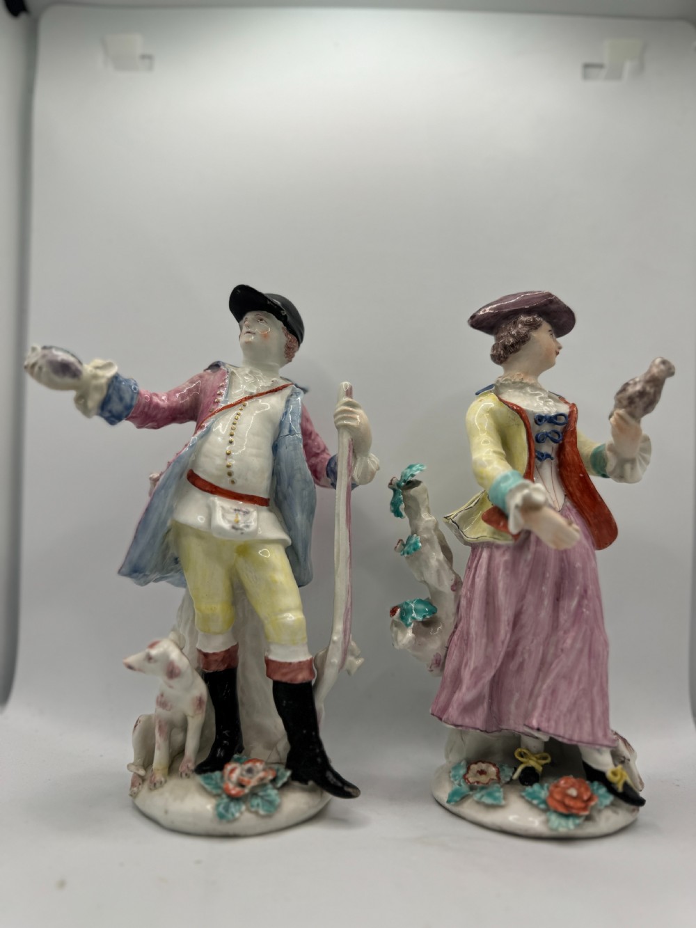 PAIR OF BOW FIGURES OF 'HUNTER' & 'LADY FALCONER'