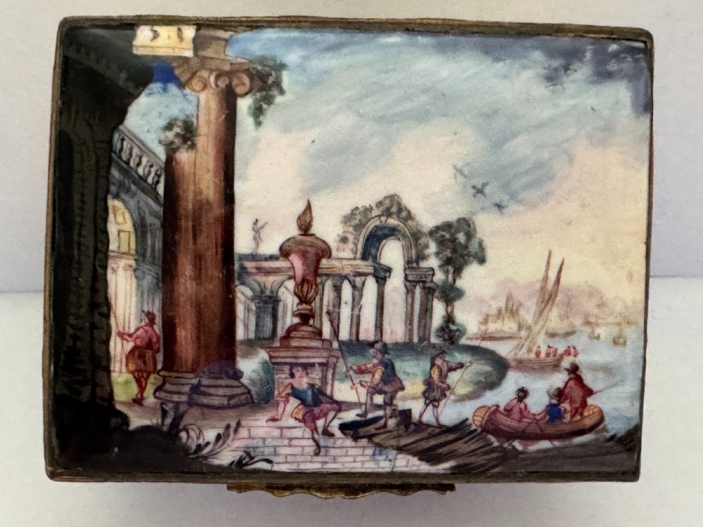 A rectangular 18th-century South Staffordshire enamel snuff box featuring a hand-painted lid with classical ruins, floral motifs on a white body, and gilded metal mounts. View III