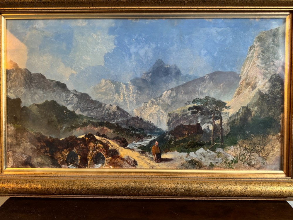 A 19th-century oil painting depicting a rocky mountain landscape with a winding stream and figures, enclosed in a gilded wooden frame. View II