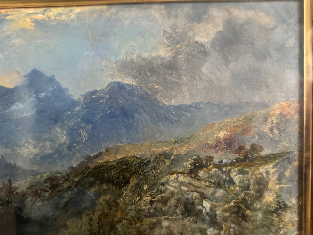 A 19th-century oil painting depicting a rocky mountain landscape with a winding stream and figures, enclosed in a gilded wooden frame. View XII