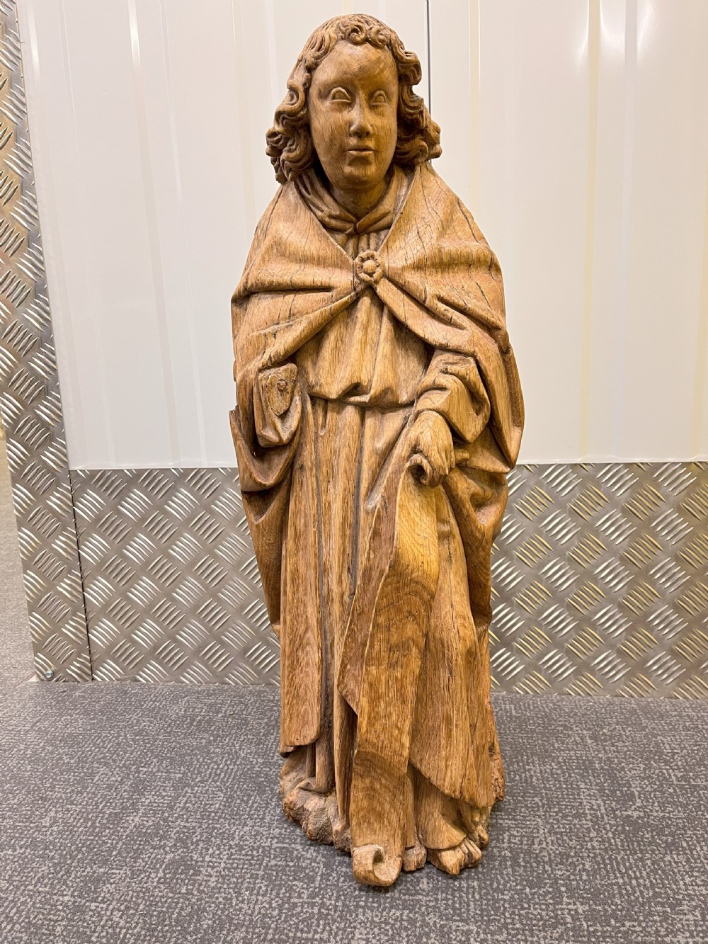 A pair of hand-carved oak sculptures depicting two standing saints in long draped robes. View XIV