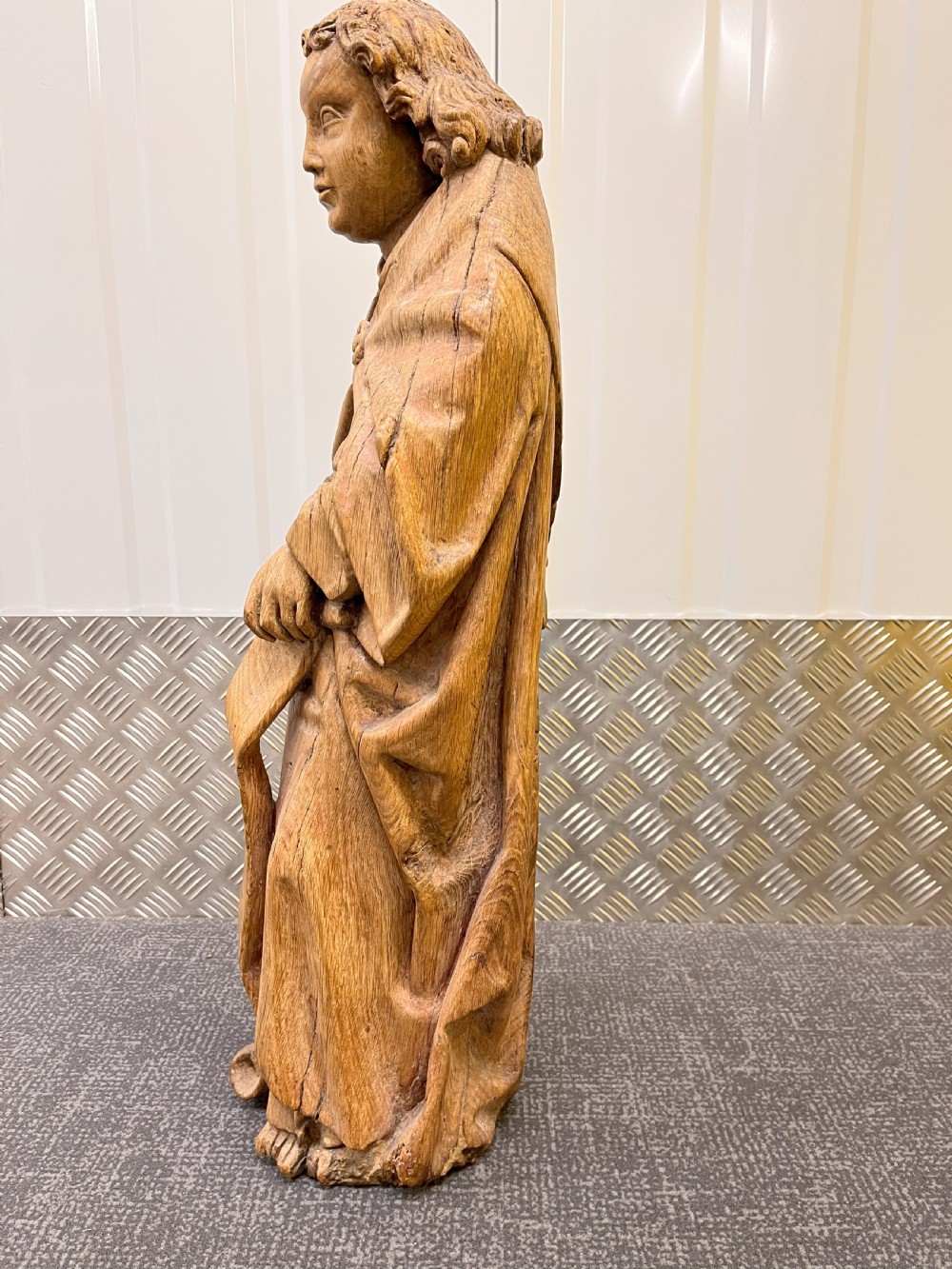 A pair of hand-carved oak sculptures depicting two standing saints in long draped robes. View II
