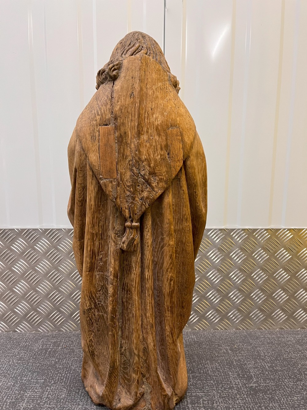 A pair of hand-carved oak sculptures depicting two standing saints in long draped robes. View III