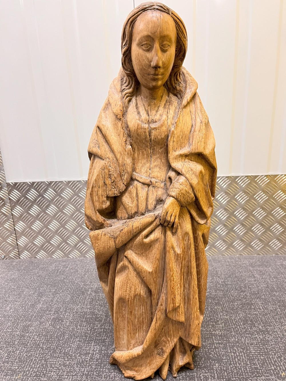 A pair of hand-carved oak sculptures depicting two standing saints in long draped robes. View VIII