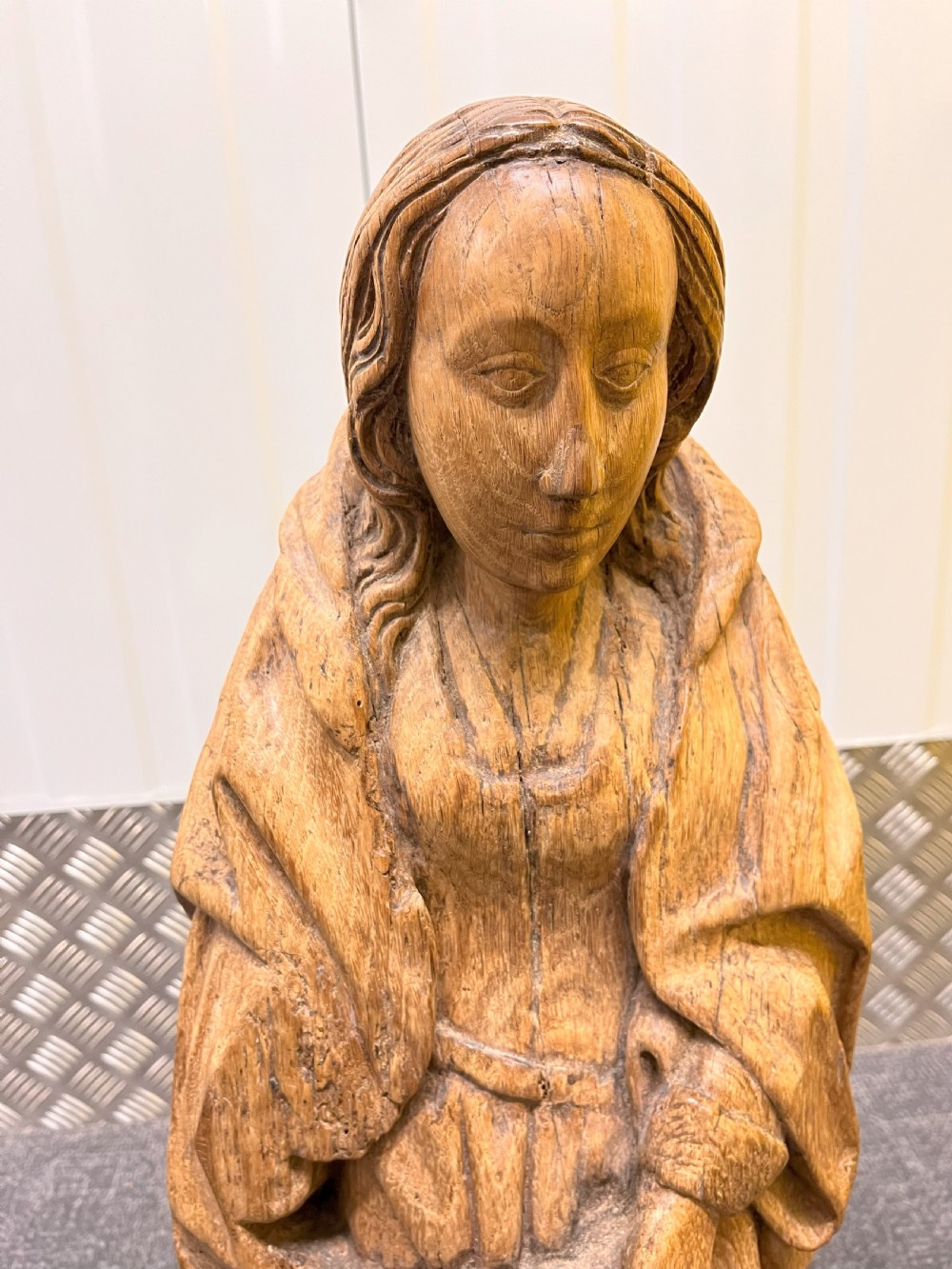 A pair of hand-carved oak sculptures depicting two standing saints in long draped robes. View IX