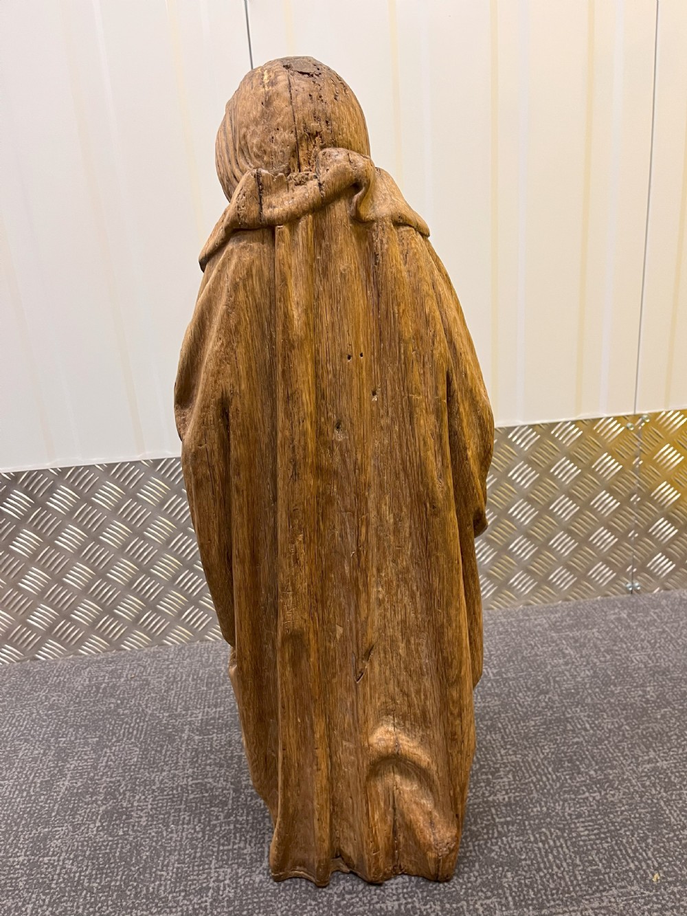 A pair of hand-carved oak sculptures depicting two standing saints in long draped robes. View X