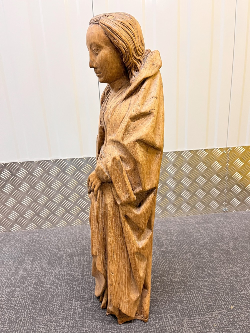 A pair of hand-carved oak sculptures depicting two standing saints in long draped robes. View XI