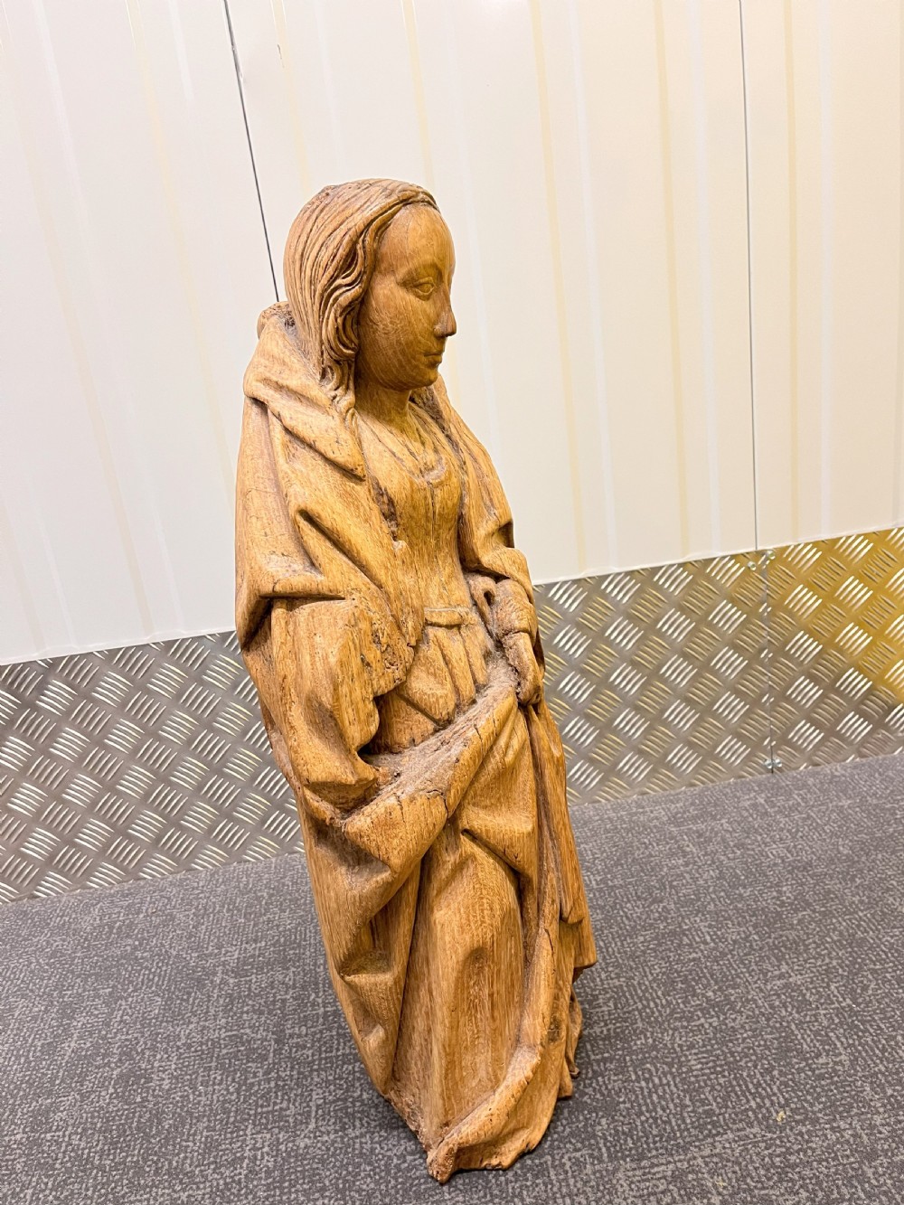A pair of hand-carved oak sculptures depicting two standing saints in long draped robes. View XII