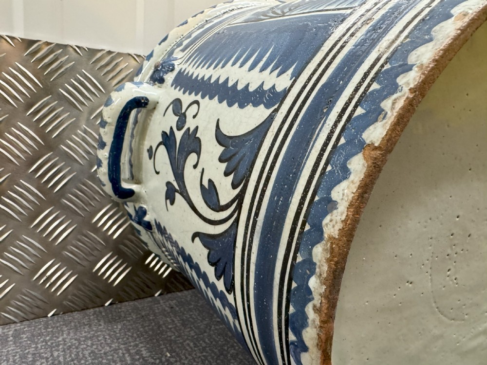 An 18th-century French Nevers faience ceramic orange pot decorated with hand-painted cobalt blue landscape motifs, geometric borders, and twin side handles. View IX