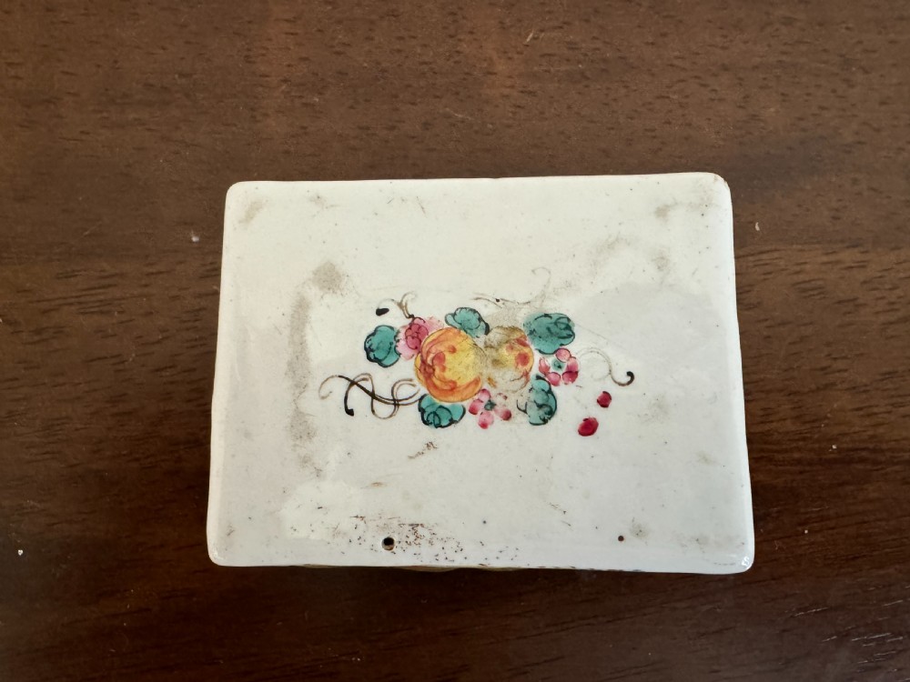 A rectangular 18th-century Chinese Beijing enamel snuff box decorated with a hand-painted scene of figures in traditional attire beside a river and framed by gilded metal. View VI