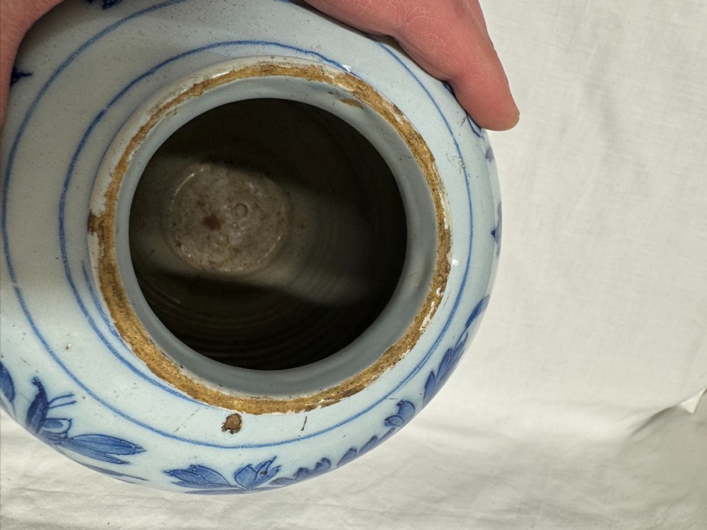 A blue and white tin-glazed earthenware baluster vase hand-painted with large floral and foliage motifs. View XIV