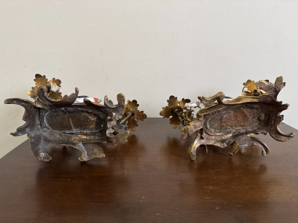 A pair of nineteenth-century French ormolu candelabra featuring hand-painted porcelain birds surrounded by gilt branches and floral mounts. View XIII