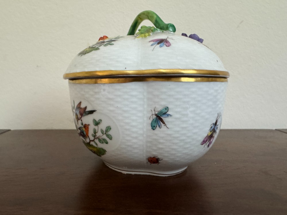 A white Dresden porcelain lidded bowl featuring relief basketweave moulding, hand-painted birds and insects, a branch handle, and gilt borders. View II