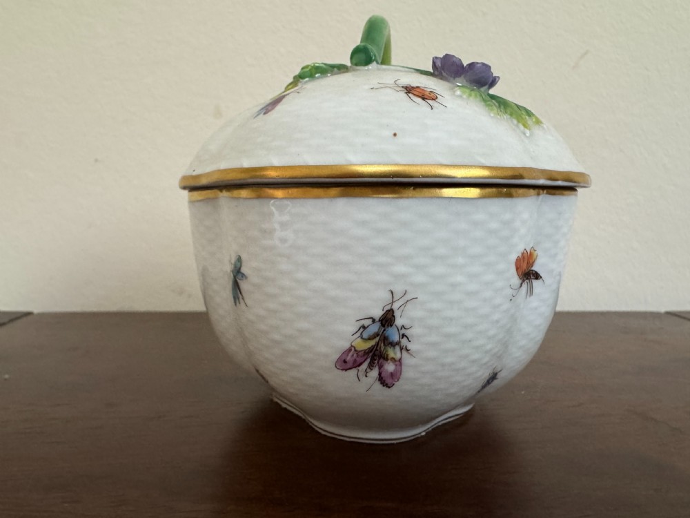 A white Dresden porcelain lidded bowl featuring relief basketweave moulding, hand-painted birds and insects, a branch handle, and gilt borders. View III