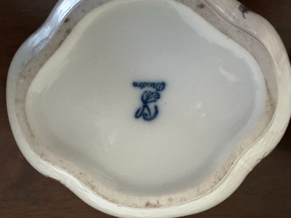 A white Dresden porcelain lidded bowl featuring relief basketweave moulding, hand-painted birds and insects, a branch handle, and gilt borders. View XII