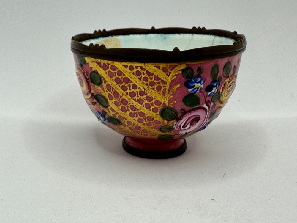 An 18th-century Limoges enamel salt bowl featuring hand-painted floral motifs on a pink ground with gilt lattice detailing and a dark metal rim. View III