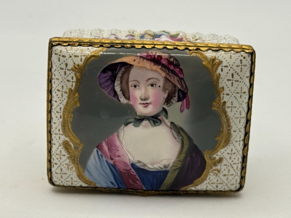 An 18th-century rectangular Bilston enamel box featuring a hand-painted portrait on the lid and floral motifs on white patterned sides. View II