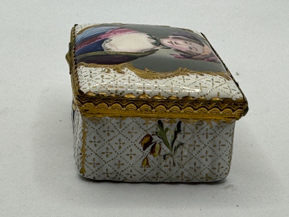 An 18th-century rectangular Bilston enamel box featuring a hand-painted portrait on the lid and floral motifs on white patterned sides. View IV