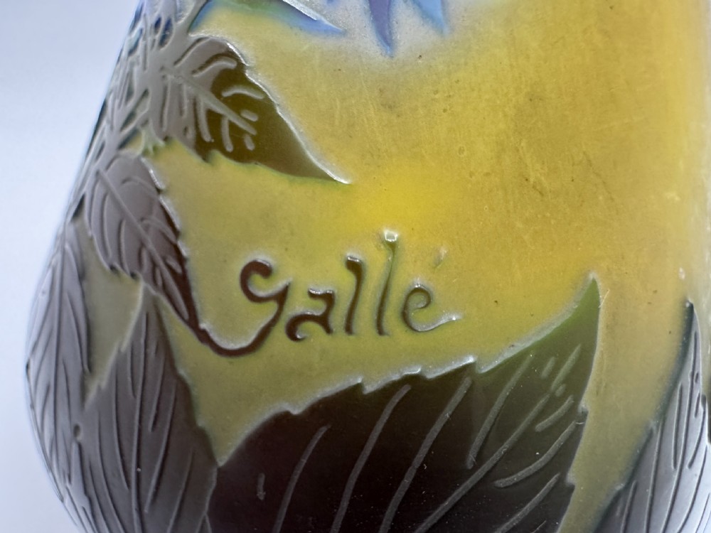 An Art Nouveau pear-shaped cameo glass vase featuring blue and green acid-etched floral motifs over a yellow background. View XIV