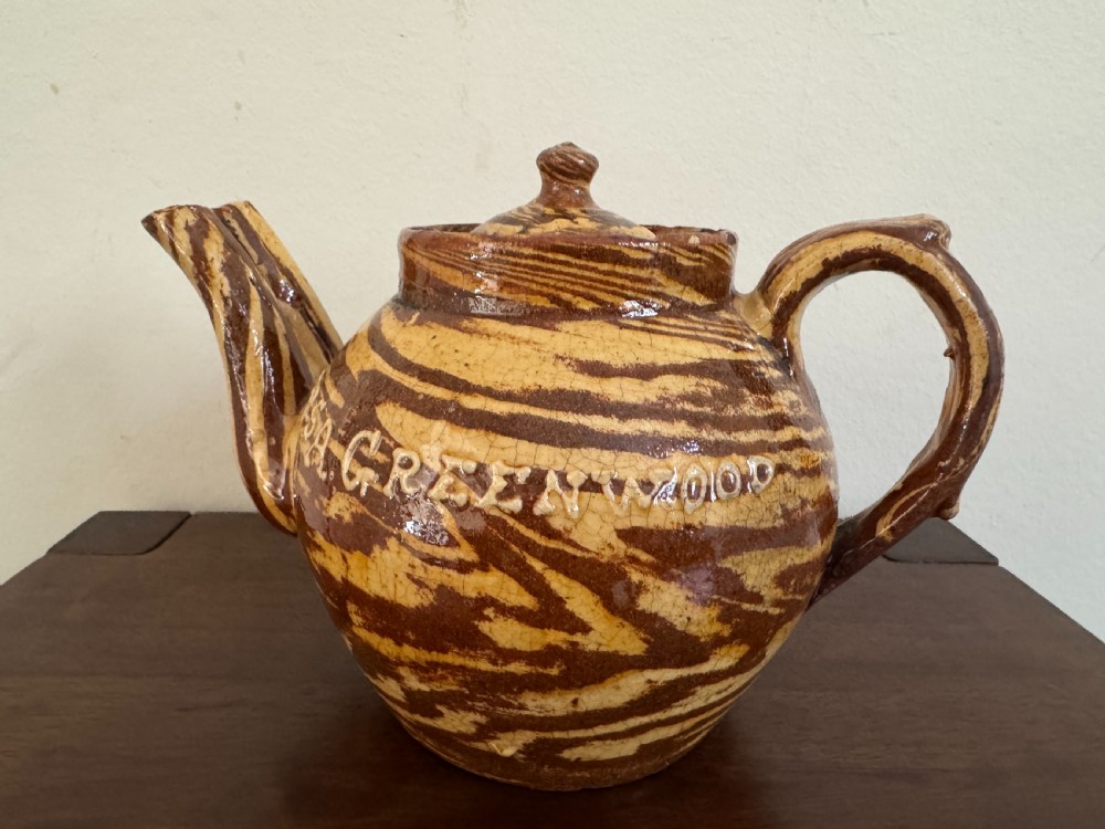 An Edwardian brown and cream marbled agateware teapot featuring twin spouts, a matching finial lid, and an inscribed date reading Todmorden Dec 1906. View VII