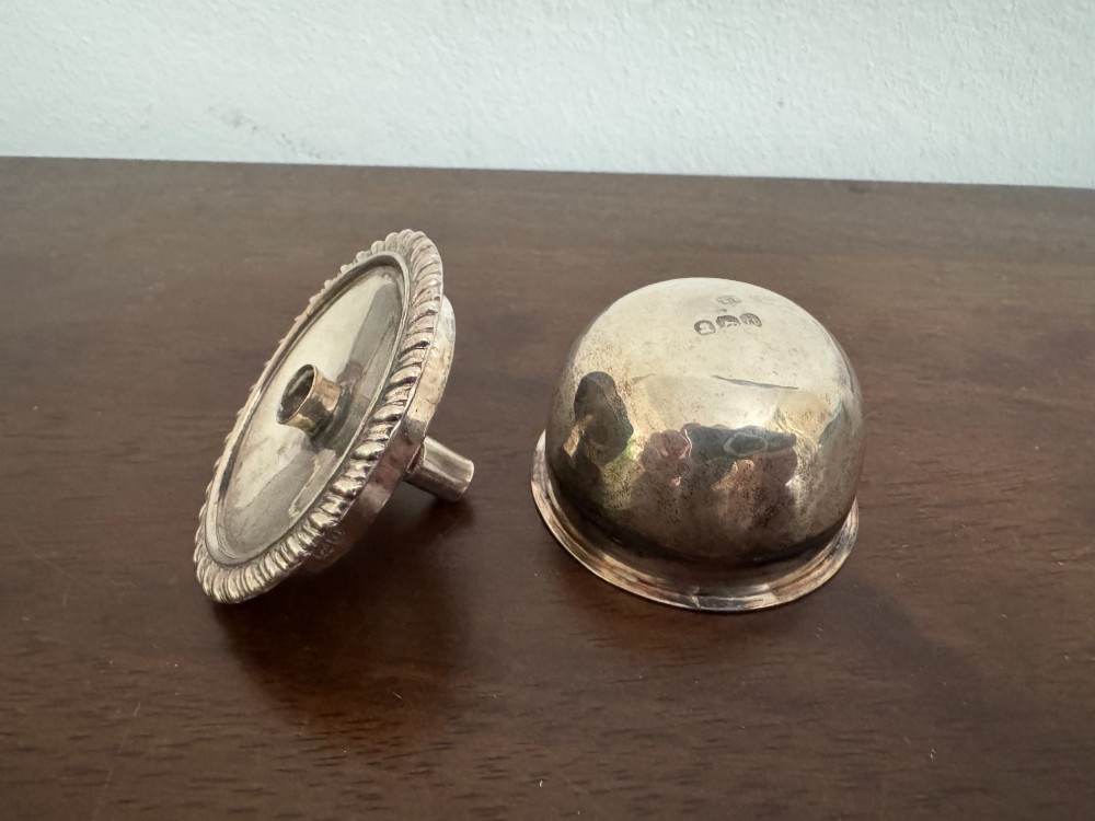 A George III sterling silver domed supper dish featuring cast handles, gadrooned borders, and a matching stand supported by paw feet. View XIV