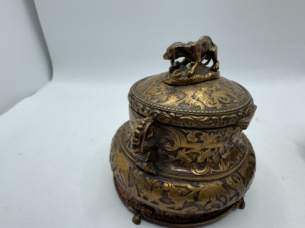 A pair of nineteenth-century gilt-metal jewellery caskets with acanthus leaf relief carving, side handles, and dog finials on the lids. View IX